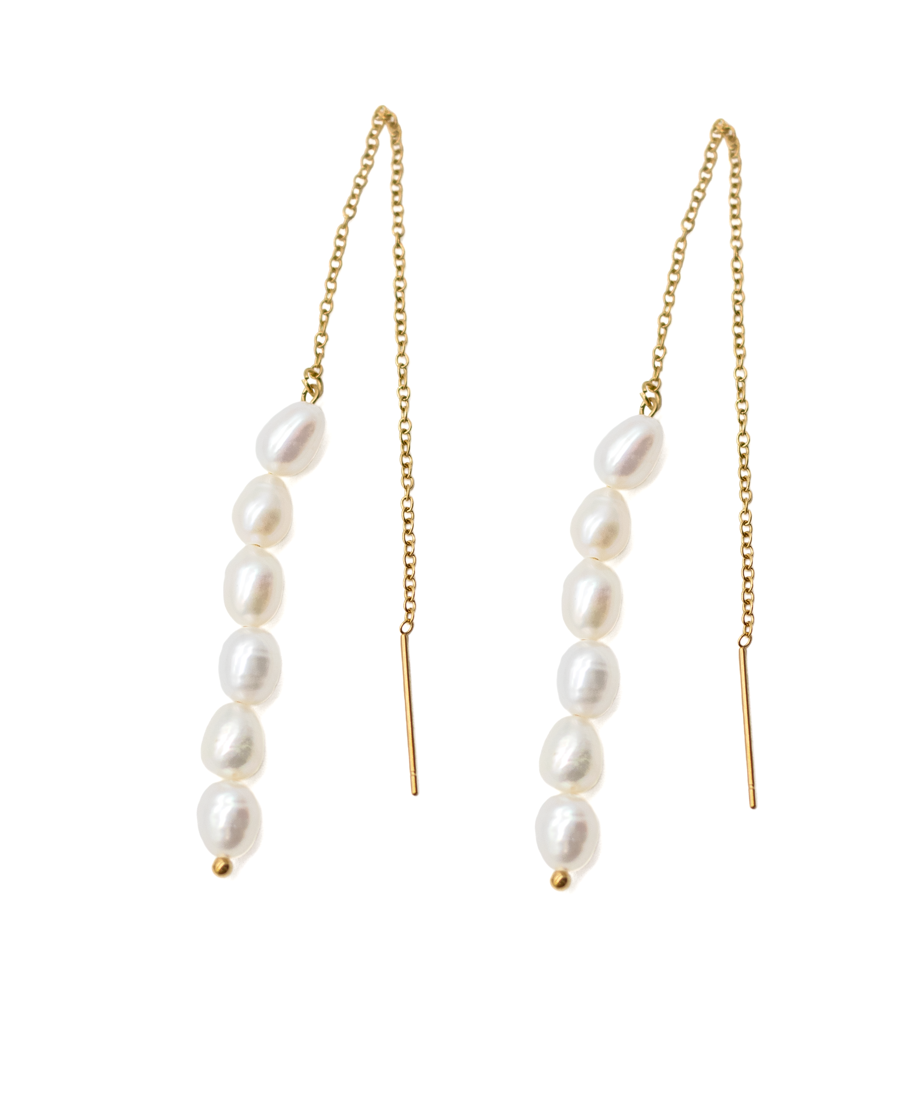 Pair of pearl drop earrings with gold chains on a white background