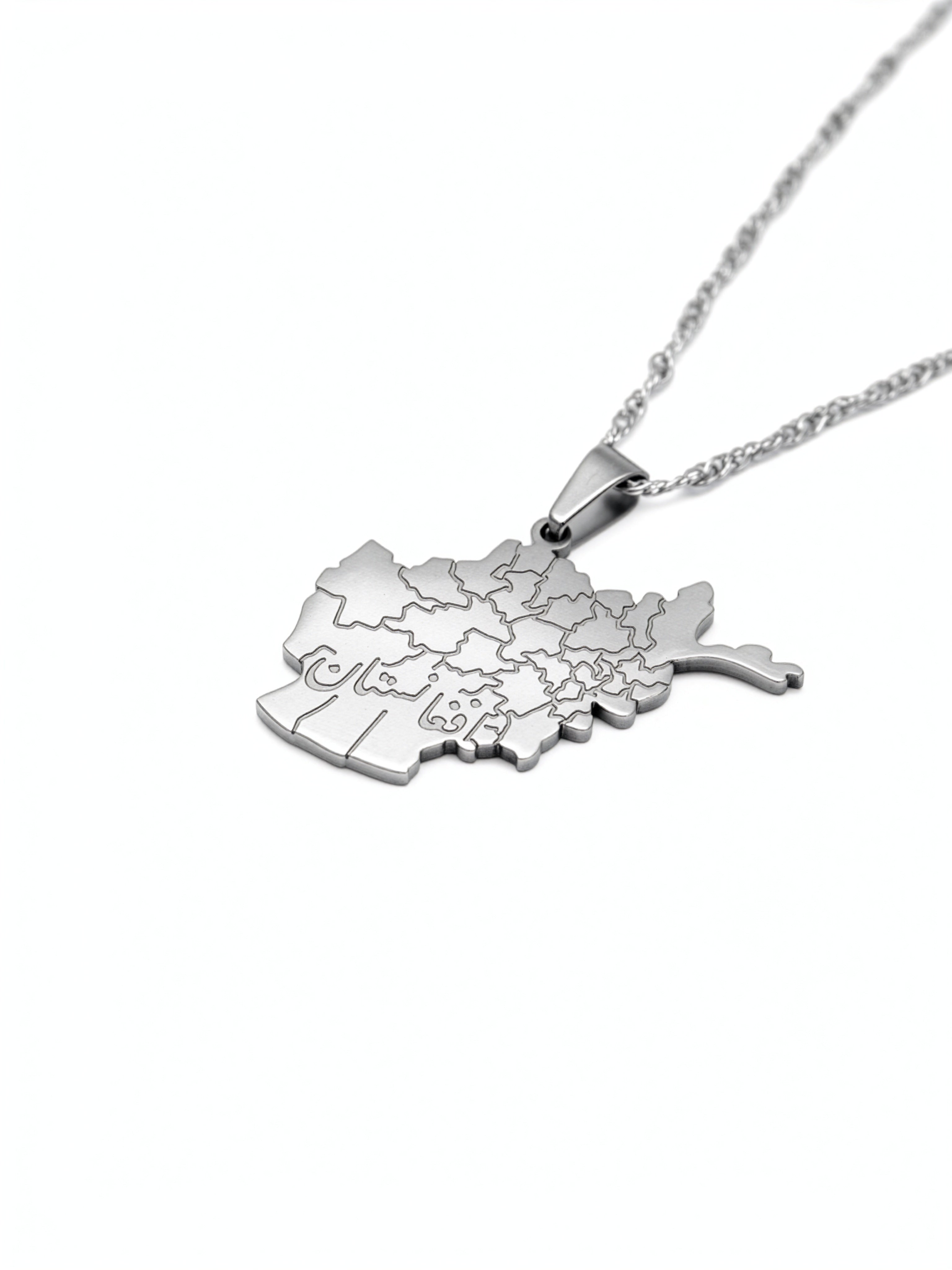 Silver plated Afghanistan map necklace with Farsi engraving on the pendant shown on a chain from KIRO UK