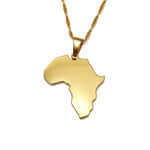 Gold necklace with a pendant shaped like the African continent on a white background