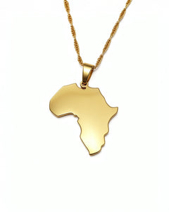 Gold necklace with a pendant shaped like the African continent on a white background