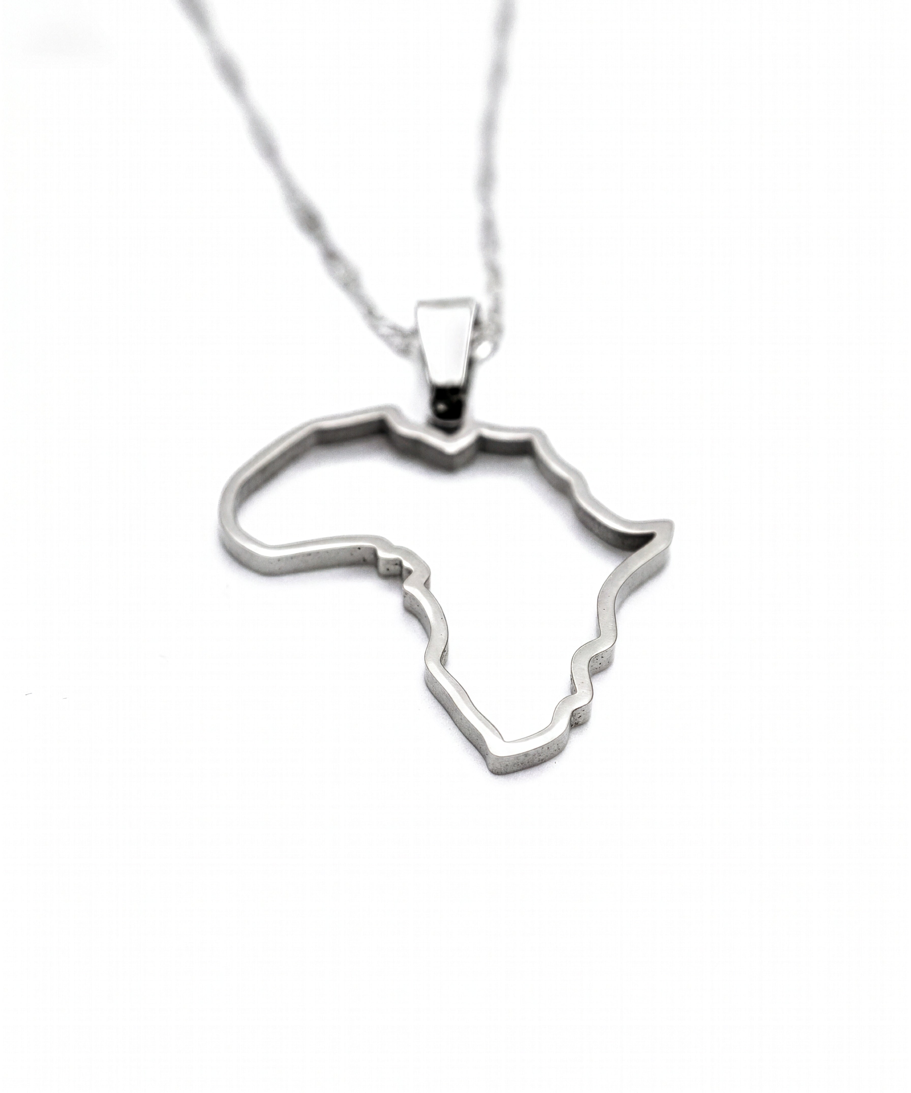 Gold Africa map outline necklace on a chain from KIRO UK celebrating African heritage with a polished pendant design