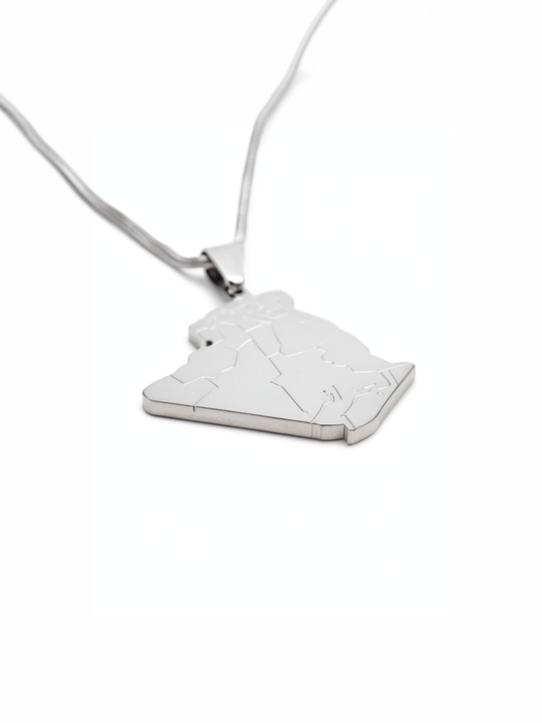 Silver plated Algeria map pendant necklace on a fine chain shown against a white background with a raised outline design for heritage inspired style
