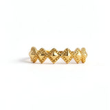 Gold plated ring with a repeating diamond design and zigzag detailing from KIRO UK in the Gold Rings collection