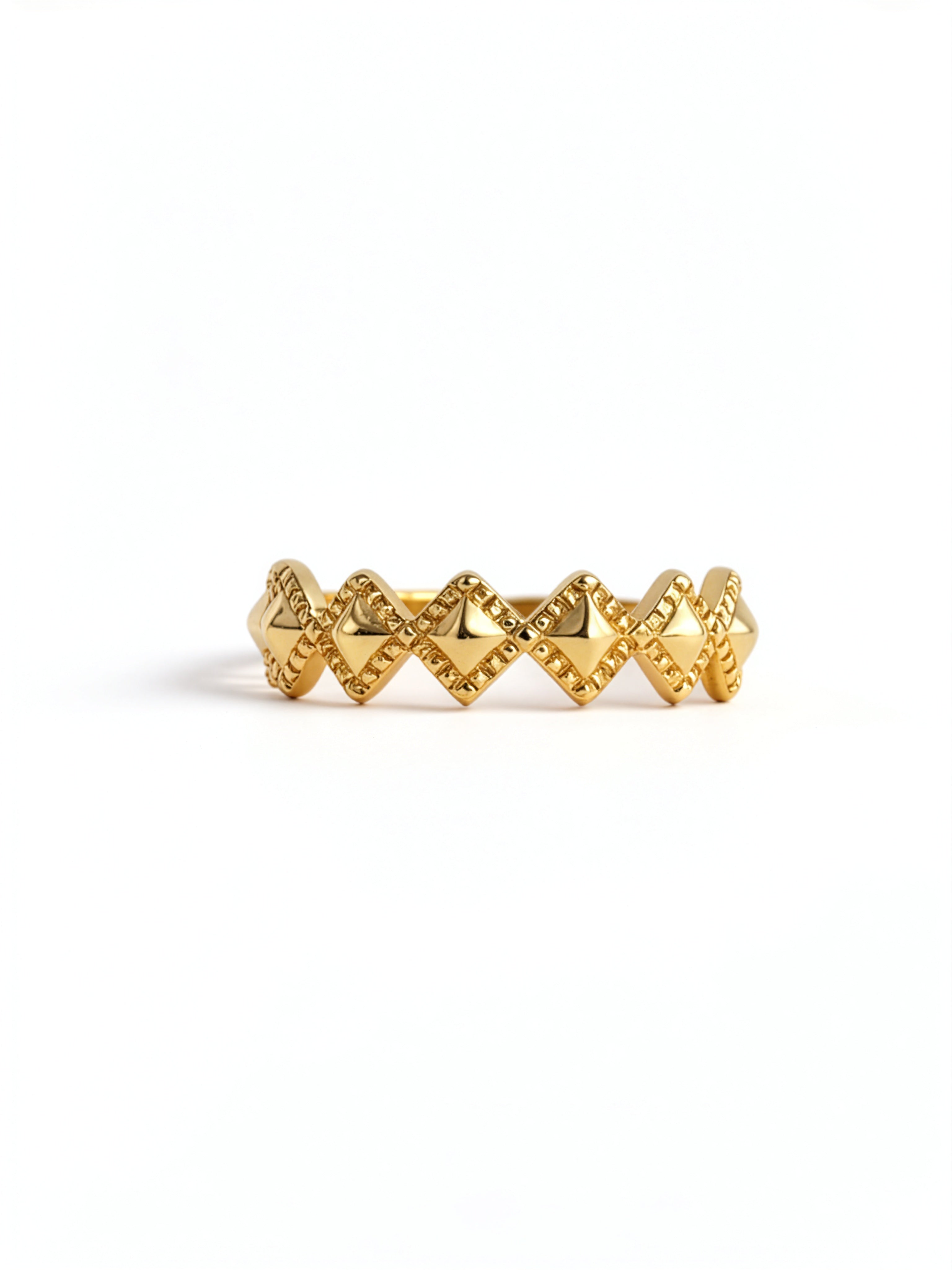 Gold plated ring with a repeating diamond design and zigzag detailing from KIRO UK in the Gold Rings collection