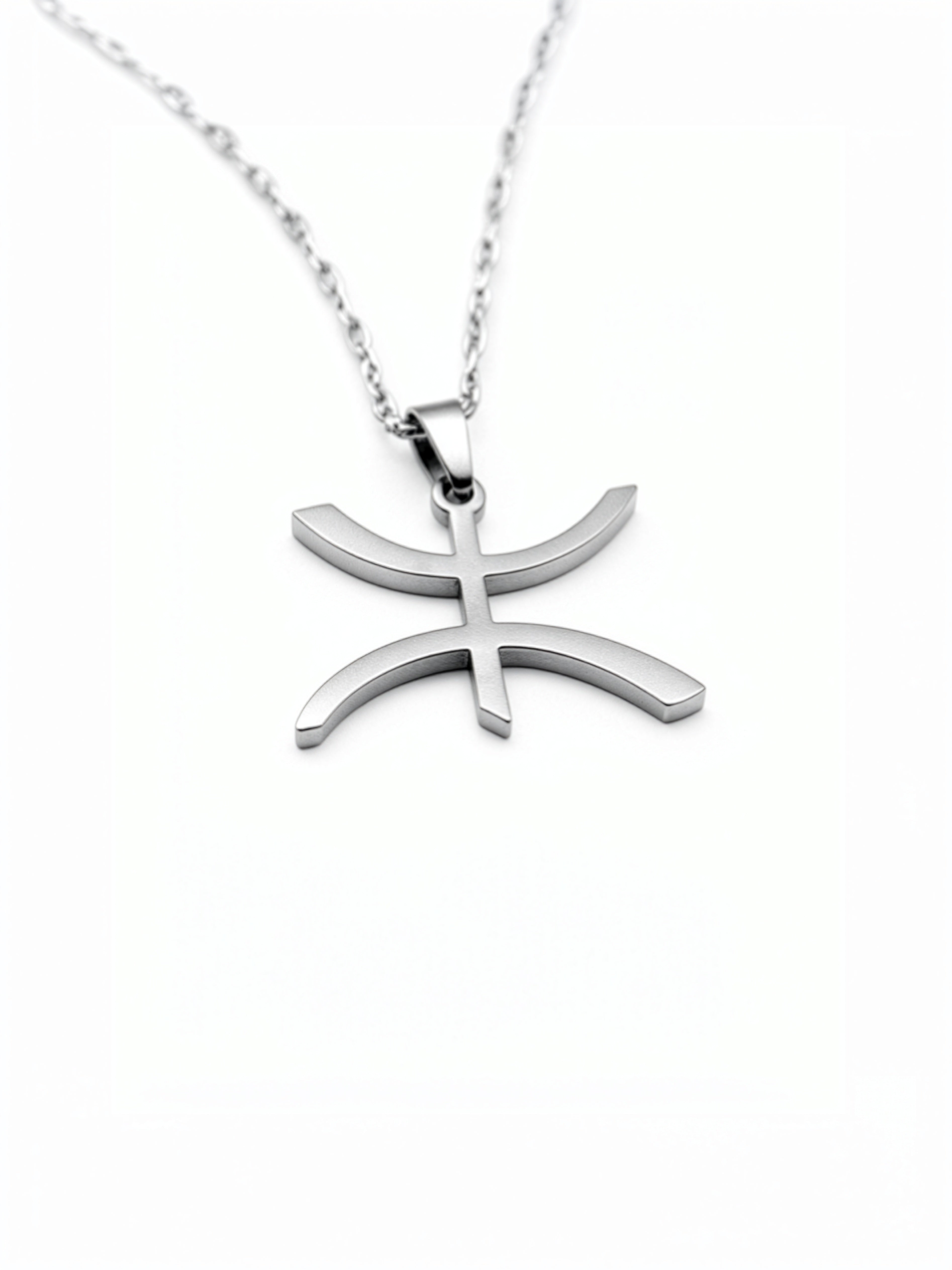 Silver plated Amazigh necklace with a curved freedom symbol pendant on a chain, celebrating cultural heritage by KIRO UK