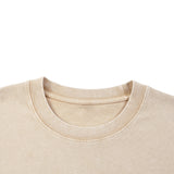 kiro Clothing beige cotton T shirt with a classic ribbed crew neckline and soft mineral wash finish shown in close up