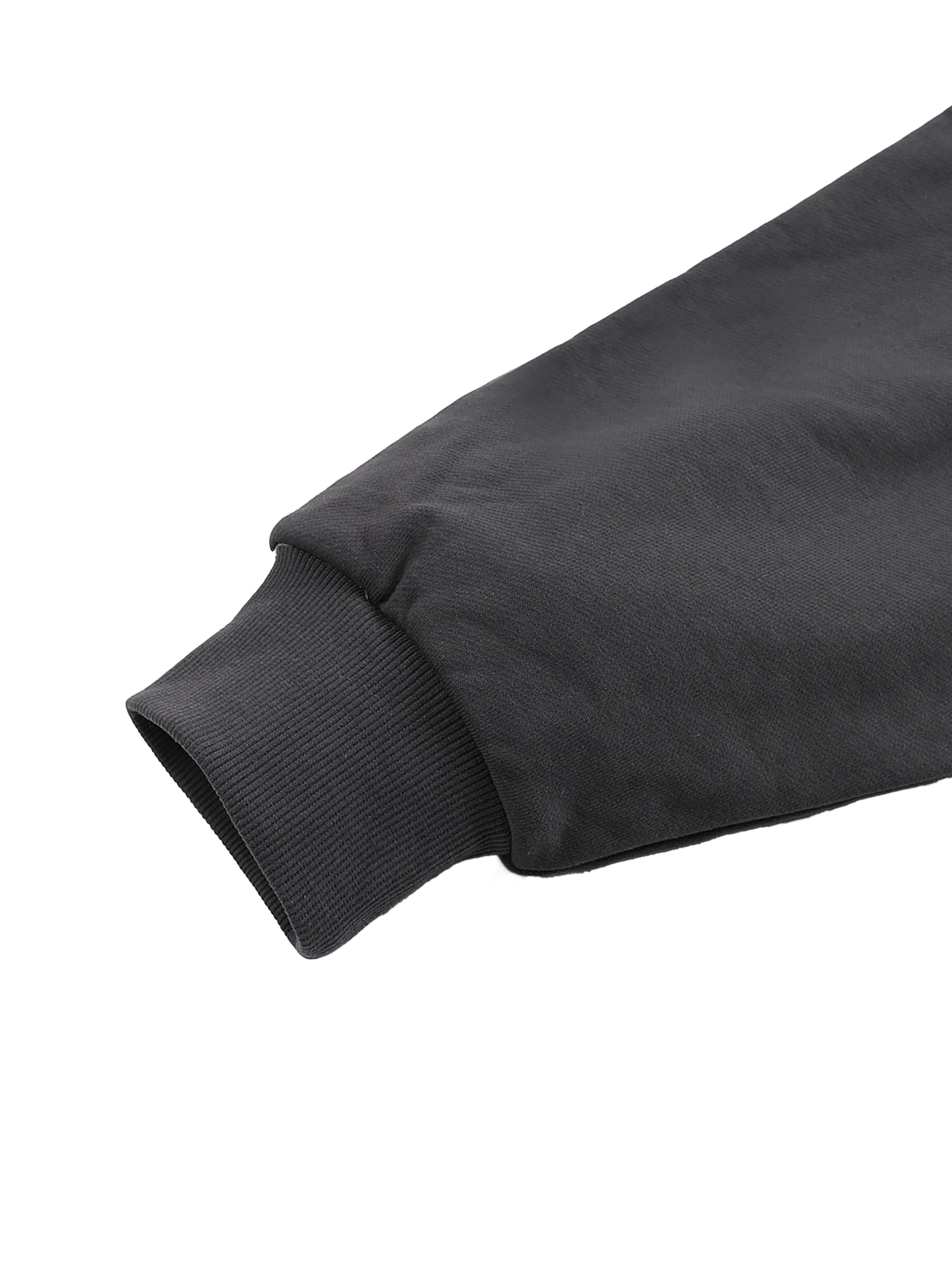 Black oversized cotton hoodie sleeve with a ribbed cuff from KIRO Clothing collection against a white background