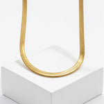 Gold plated Egyptian statement necklace with a textured collar chain displayed on a white pedestal from KIRO UK Egyptian Collection
