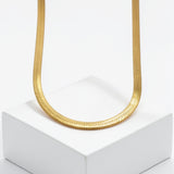 Gold plated Egyptian statement necklace with a textured collar chain displayed on a white pedestal from KIRO UK Egyptian Collection