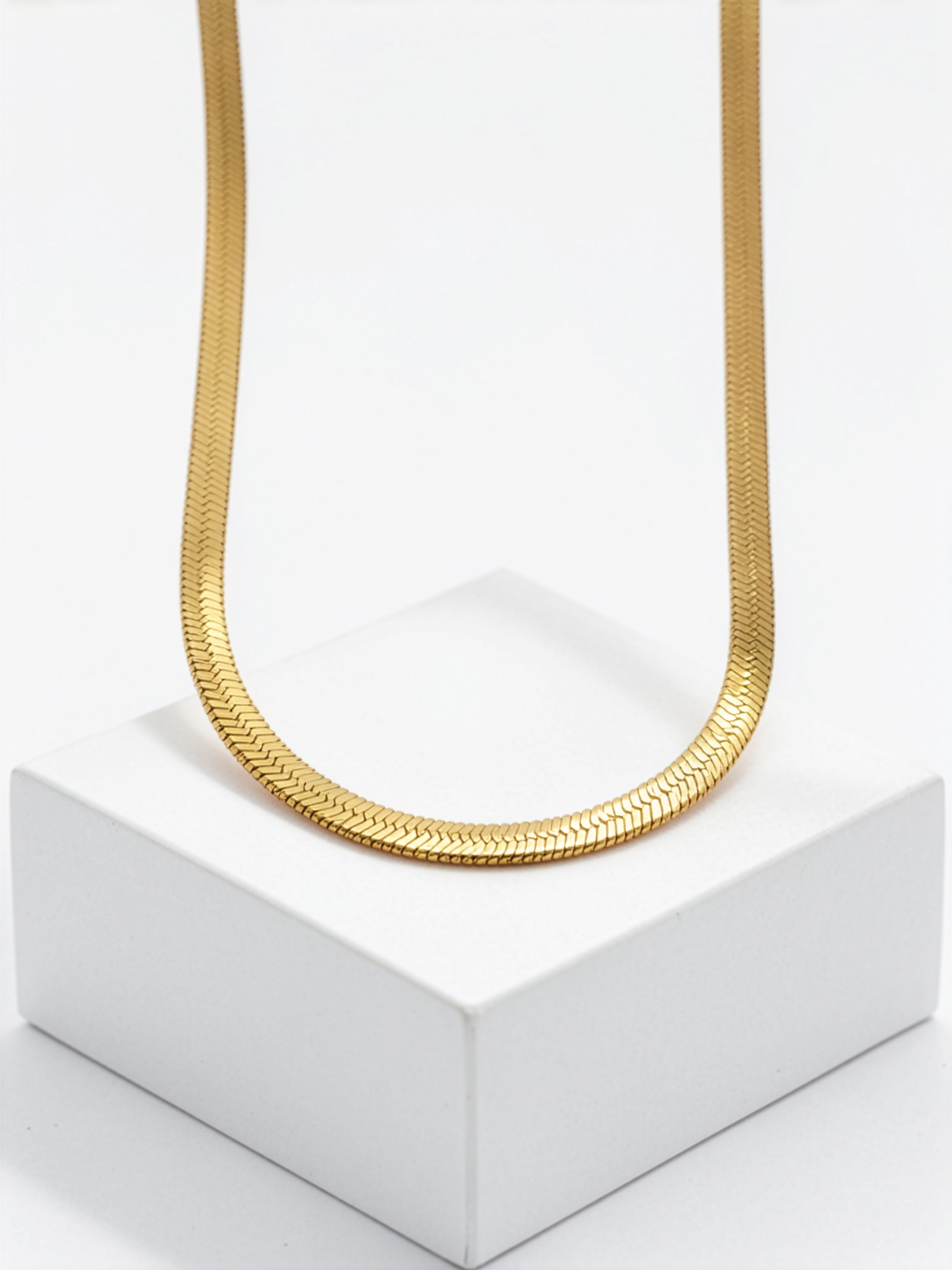 Gold plated Egyptian statement necklace with a textured collar chain displayed on a white pedestal from KIRO UK Egyptian Collection