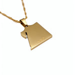 Gold plated Egyptian map pendant necklace by KIRO UK with a polished outline design and KIRO engraving on a delicate chain