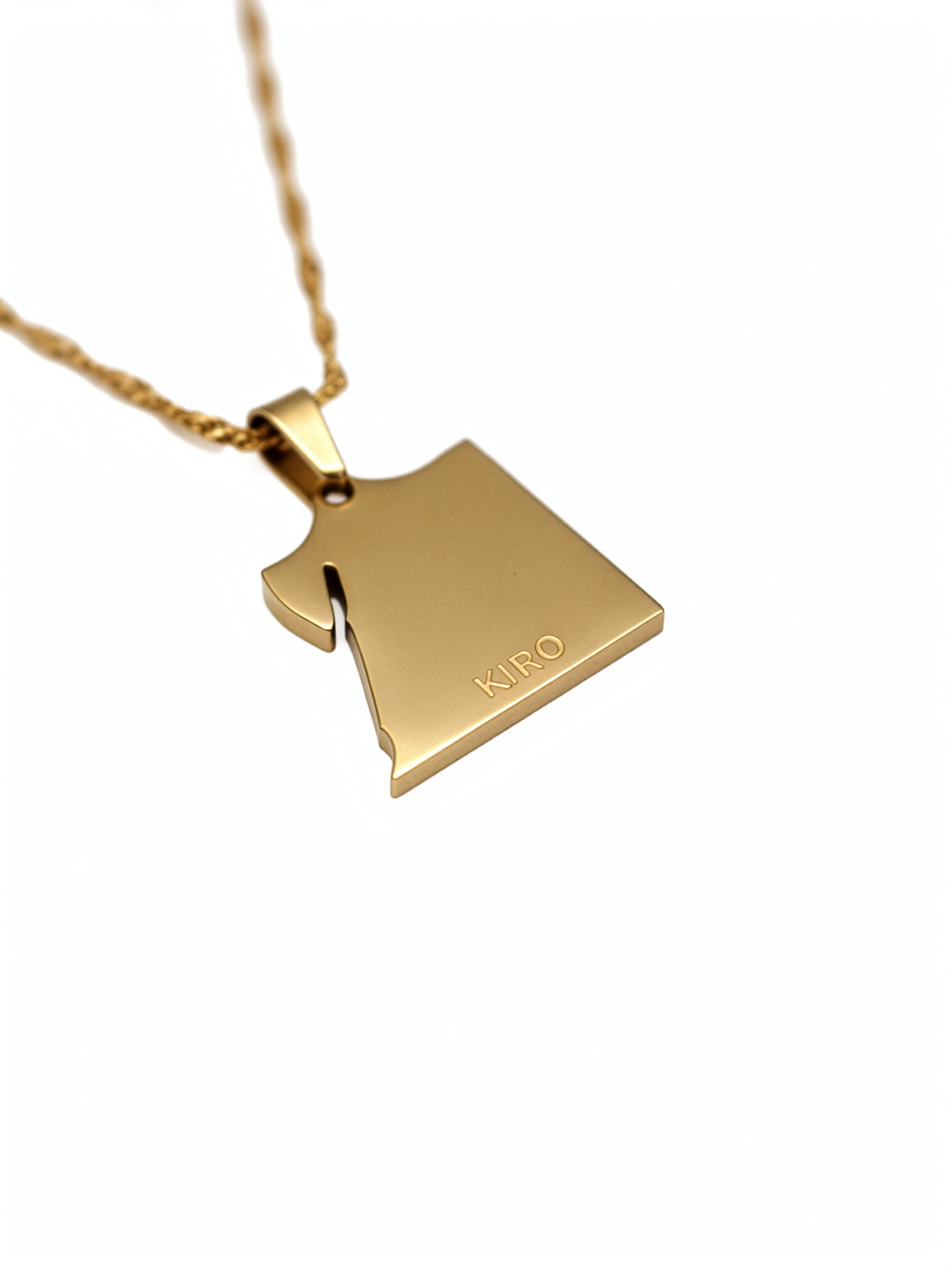 Gold plated Egyptian map pendant necklace by KIRO UK with a polished outline design and KIRO engraving on a delicate chain