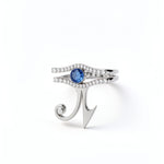 KIRO UK Eye of Horus ring in silver with a central sapphire and cubic zirconia details forming a geometric Egyptian symbol