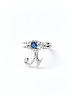 KIRO UK Eye of Horus ring in silver with a central sapphire and cubic zirconia details forming a geometric Egyptian symbol
