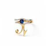 KIRO UK Eye of Horus ring with two stackable gold vermeil bands lined with cubic zirconia and a central blue sapphire on white background
