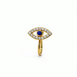 Gold faux nose cuff featuring an evil eye design with a blue sapphire centerpiece and surrounding cubic zirconia gems on a white background