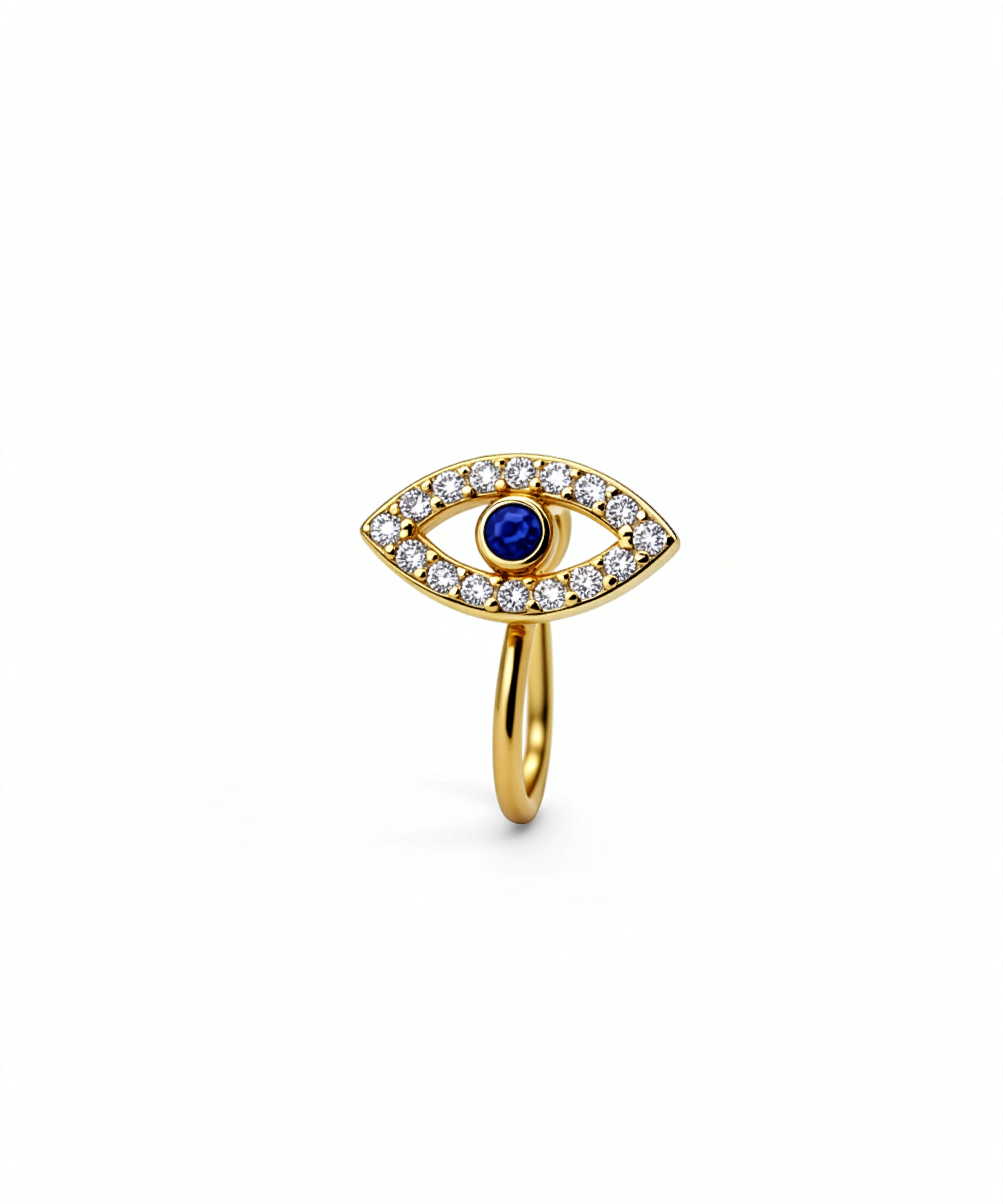 Gold faux nose cuff featuring an evil eye design with a blue sapphire centerpiece and surrounding cubic zirconia gems on a white background