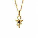 KIRO gold Ankh Horus fusion pendant necklace with a central black gemstone on a delicate chain
