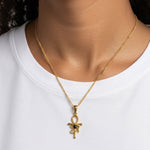 KIRO gold Ankh Horus fusion pendant necklace with a central black gemstone worn on a delicate chain