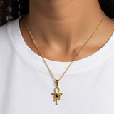 KIRO gold Ankh Horus fusion pendant necklace with a central black gemstone worn on a delicate chain