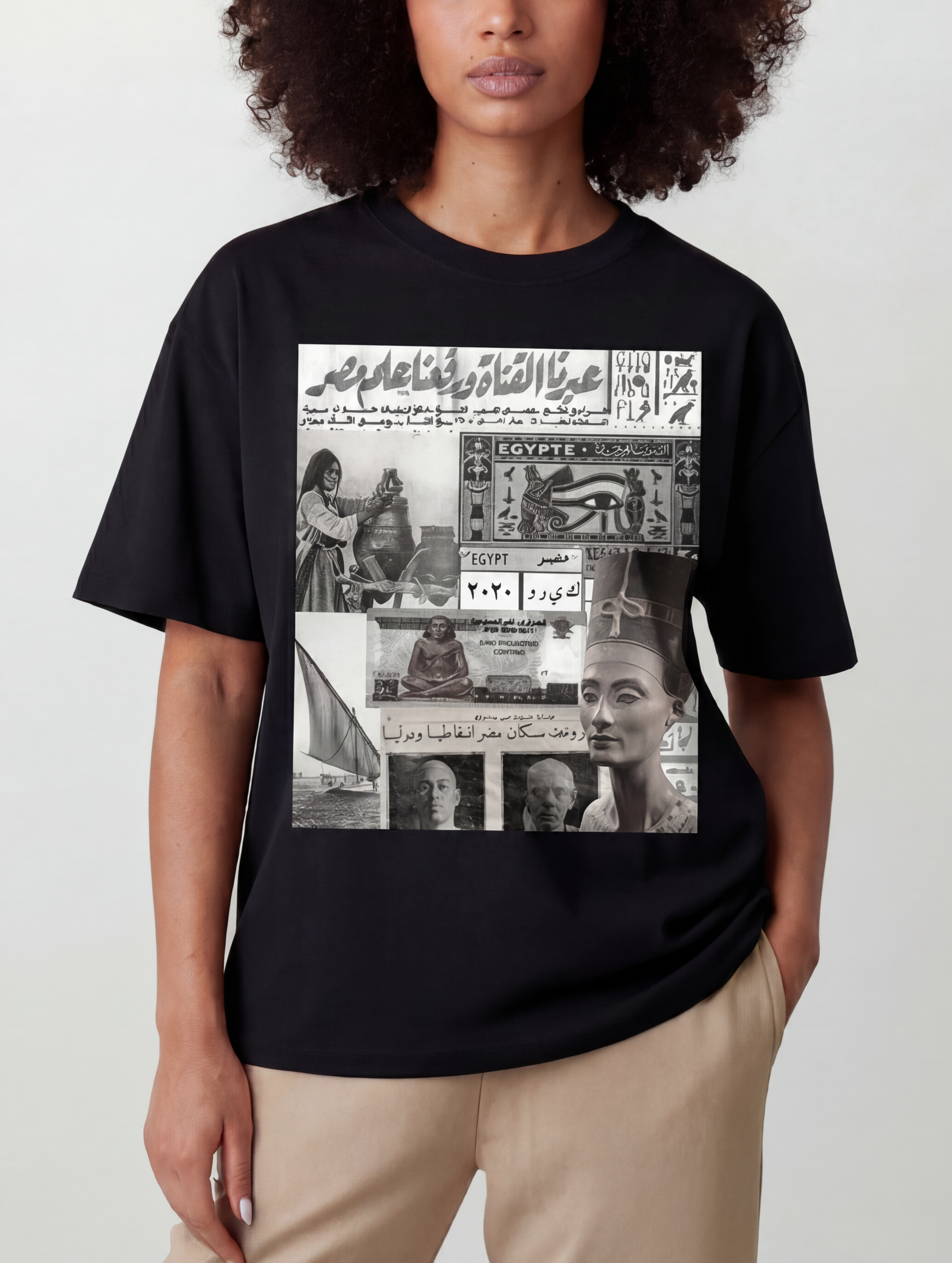Black Egyptian collage cotton tee modeled by a woman featuring Queen Nefertiti a felukah Egyptian currency postage stamp and historical newspaper imagery from KIRO Clothing