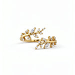 Gold plated Hathora ring with branching stem design and sparkling cubic zirconia accents on a white background by KIRO UK
