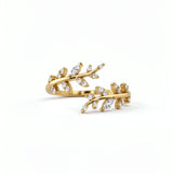 Gold plated Hathora ring with branching stem design and sparkling cubic zirconia accents on a white background by KIRO UK