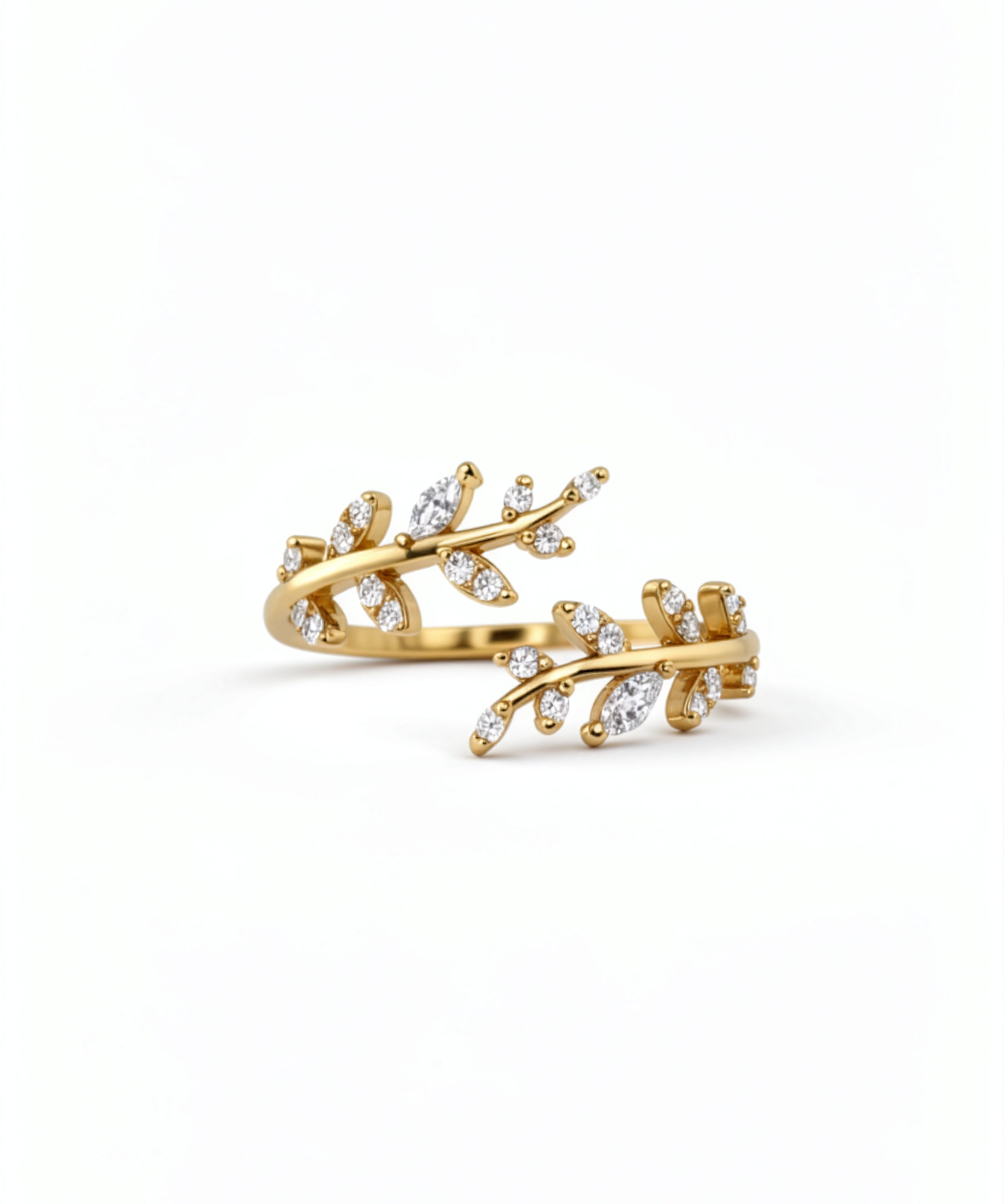 Gold plated Hathora ring with branching stem design and sparkling cubic zirconia accents on a white background by KIRO UK