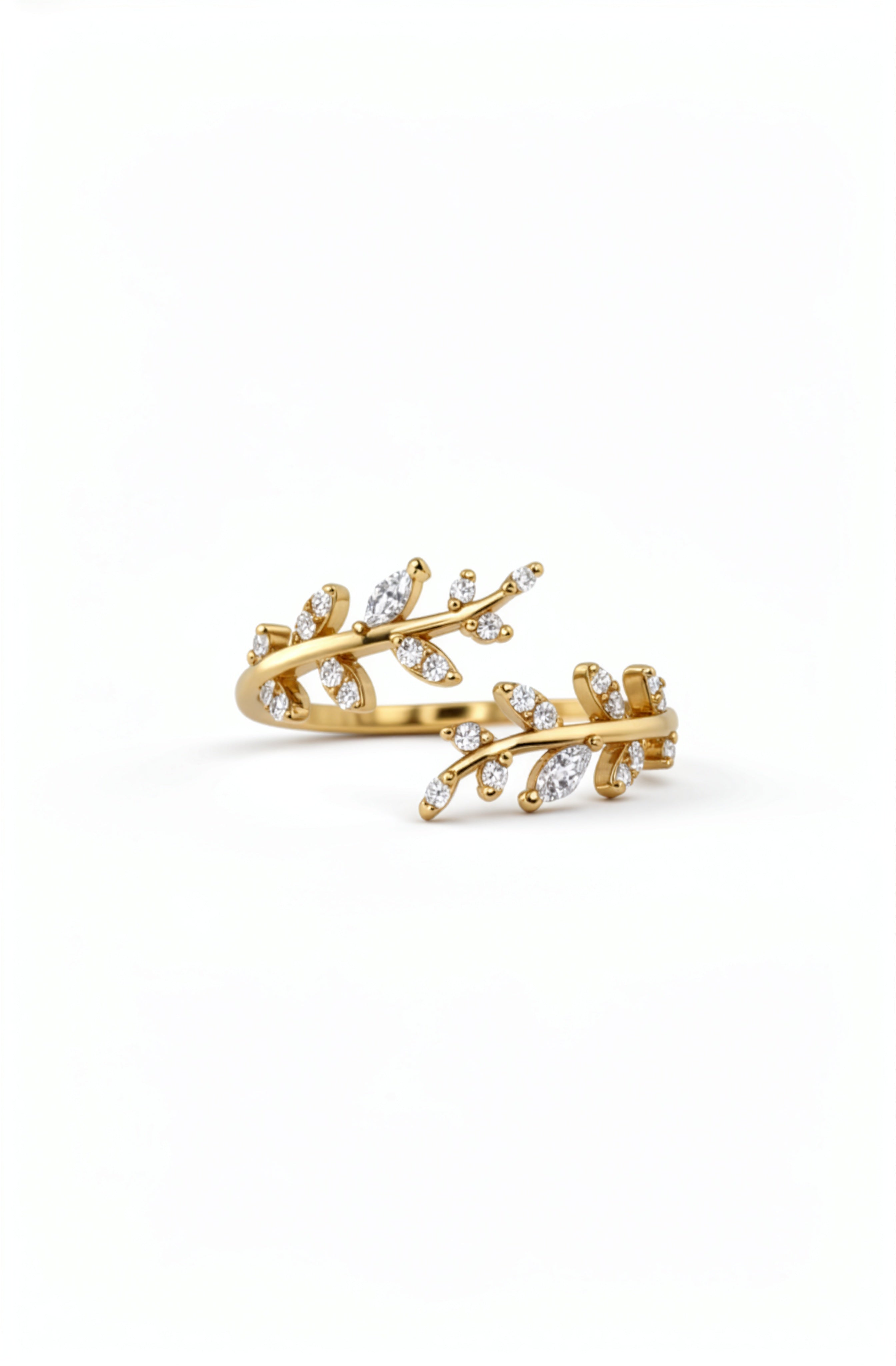Gold plated Hathora ring with branching stem design and sparkling cubic zirconia accents on a white background by KIRO UK
