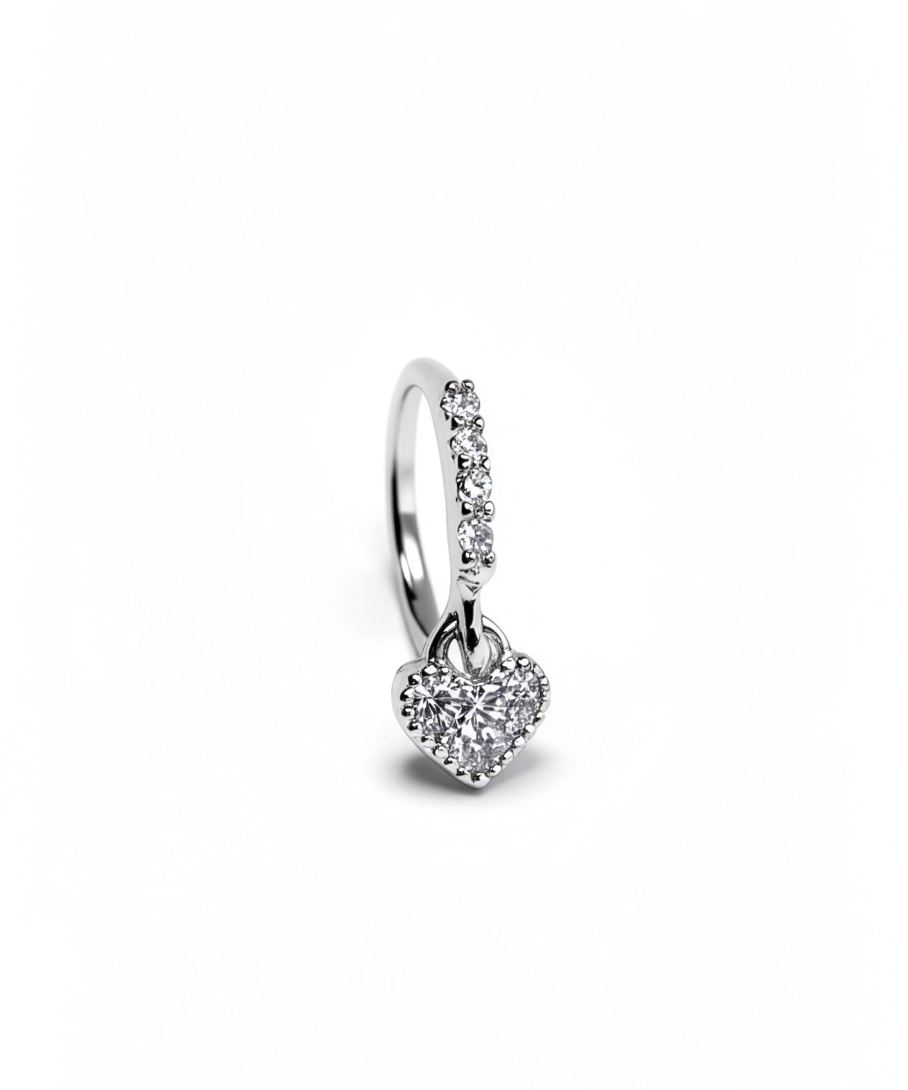 925 sterling silver nose ring with a sparkling cubic zirconia heart charm dangling below the hoop on a white background