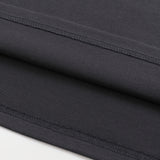 KIRO Egyptian Collage black cotton T shirt close up showing neat stitched hems and folded fabric layers by KIRO from the Clothing collection
