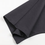 Close up of black cotton t shirt fabric and folded hem from KIRO in Clothing