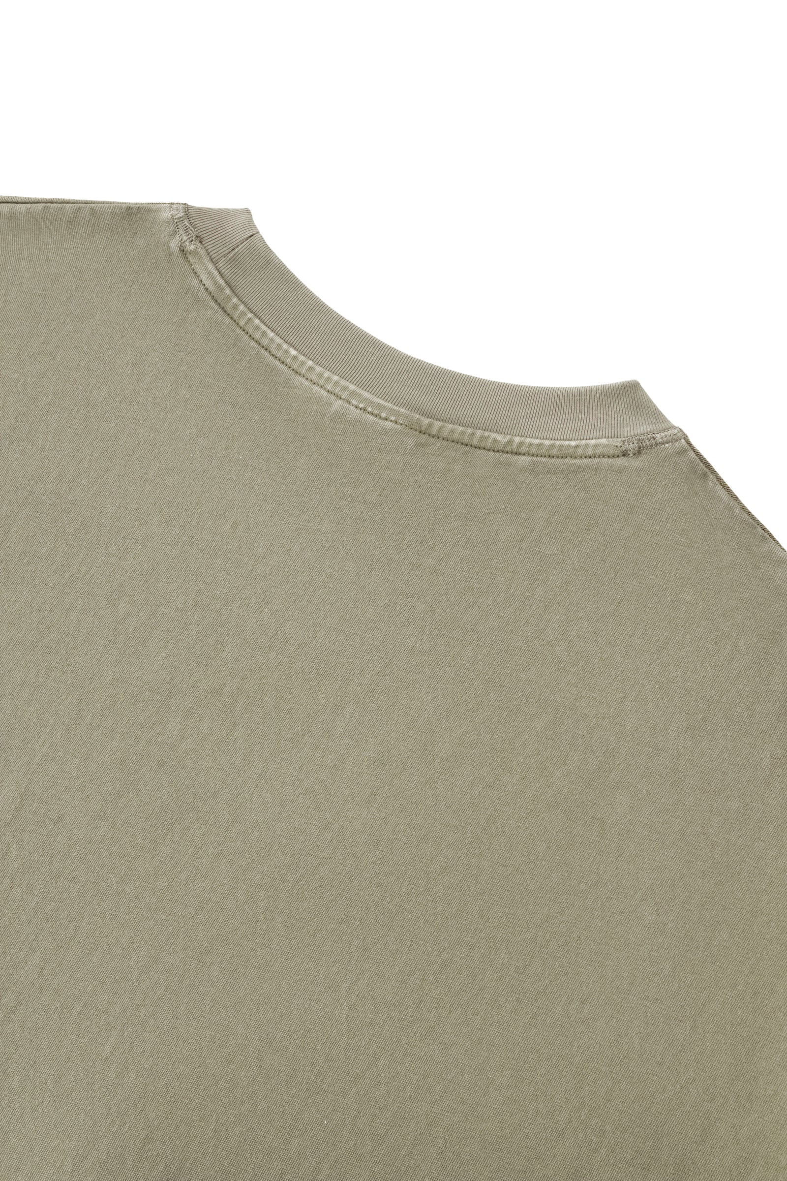Close up of a green cotton T shirt neckline and soft fabric from KIRO