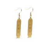 KIRO 18K gold plated stainless steel drop earrings featuring engraved Egyptian hieroglyph cartouche pendants.