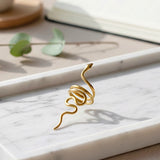 KIRO gold plated snake ring with intricate detailing, a statement accessory for elegant style. Resizable.
