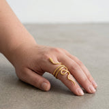 KIRO gold plated snake ring with intricate detailing, wraps around finger. Resizable statement jewelry.