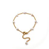 kiro freshwater pearl anklet featuring 7 pearls on an 18k gold chain.