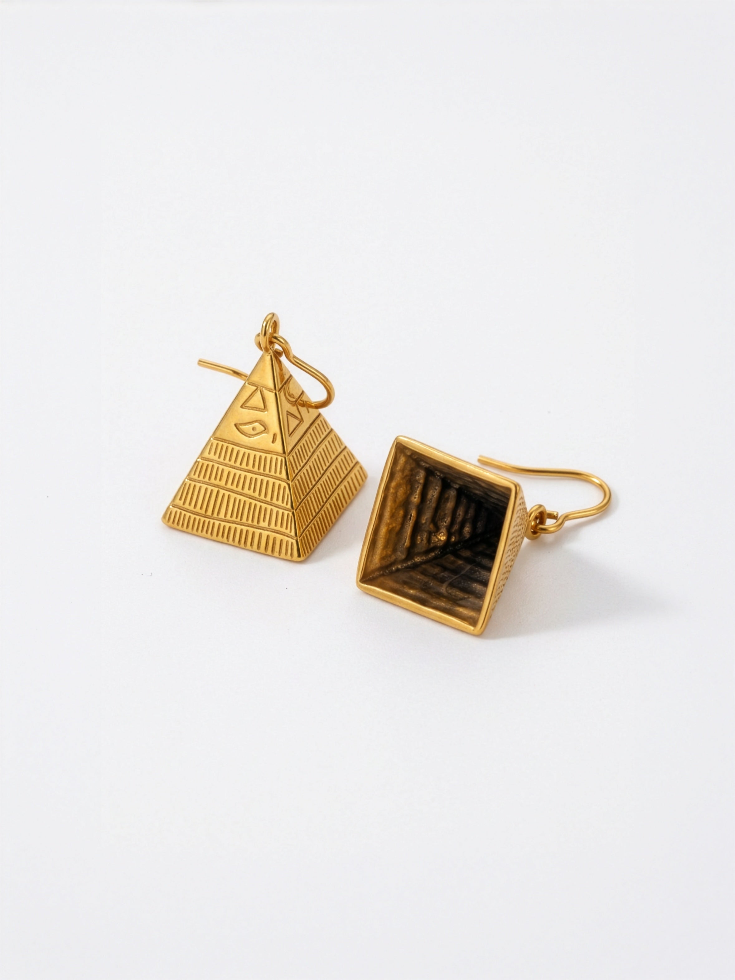 KIRO 18k Gold Plated Hollow pyramid earrings with hieroglyphic design and pattern on each side.