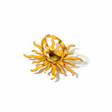 KIRO gold ring in the shape of a sun shining with several large rays and small rays. The ring is adjustable to size.
