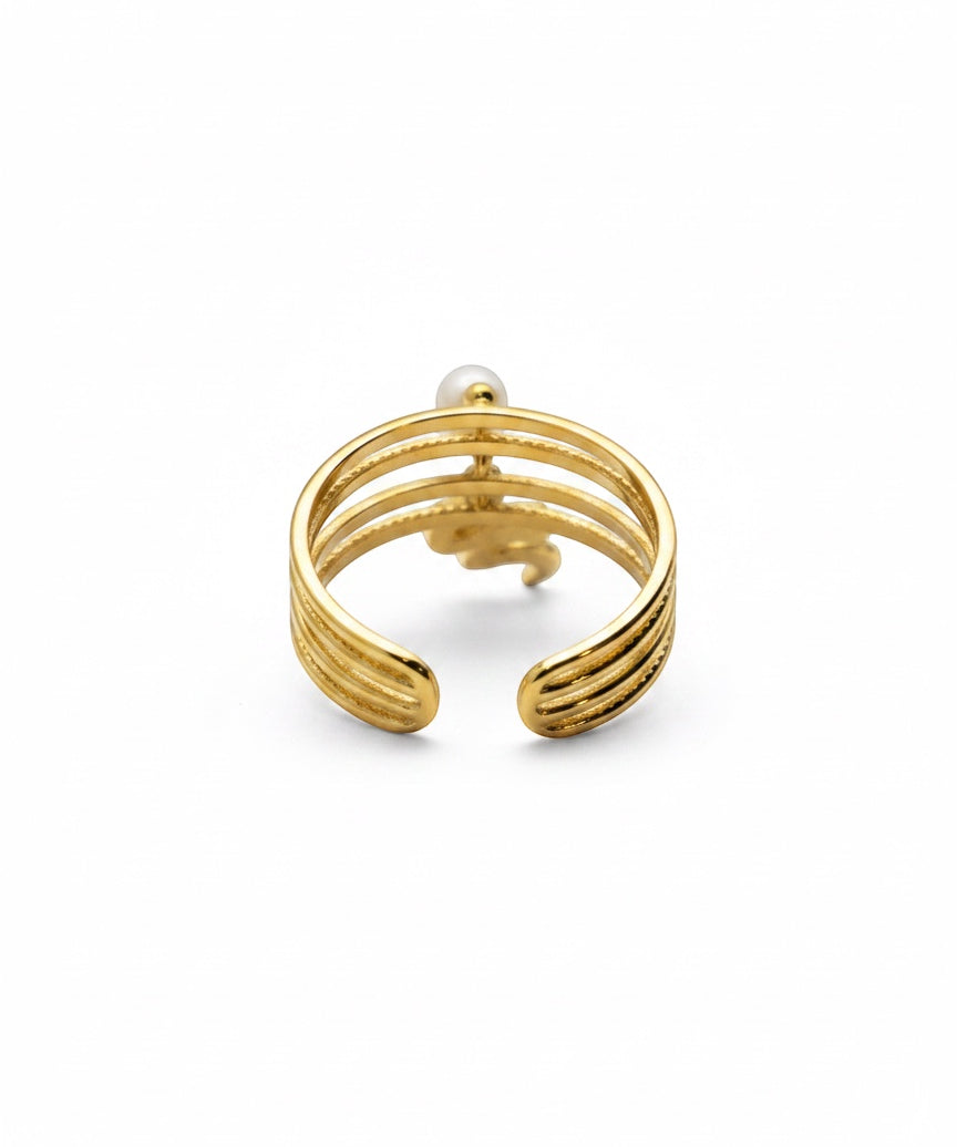 KIRO gold plated stackable ring with a serpent design and a small pearl accent. Resizeable.