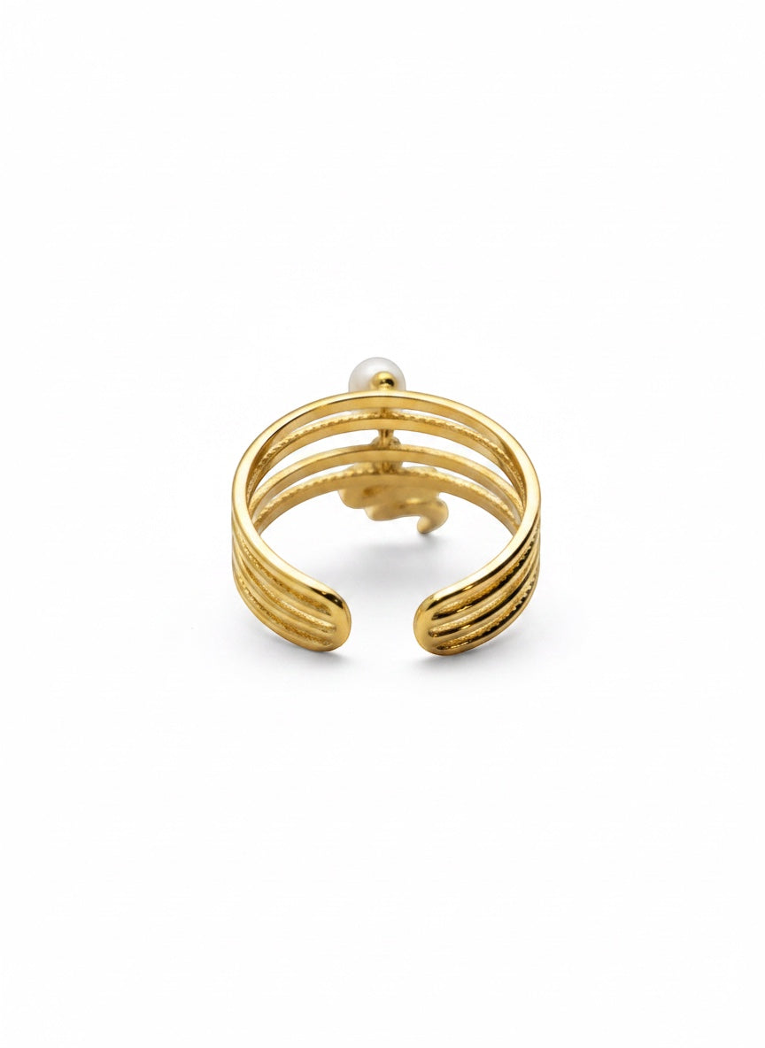 KIRO gold plated stackable ring with a serpent design and a small pearl accent. Resizeable.