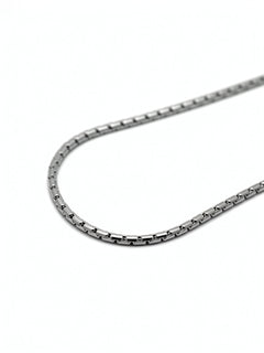 Close up view of a polished silver men's chain necklace arranged in a gentle curve on a white background from KIRO UK