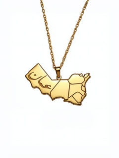 Gold tone Oman map necklace with Arabic engraving on the pendant and a chain by KIRO UK celebrating Omani heritage