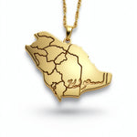 Gold Saudi Arabia map necklace with detailed regional borders and a textured chain from KIRO UK. A statement piece celebrating national pride.