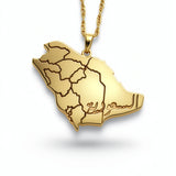 Gold Saudi Arabia map necklace with detailed regional borders and a textured chain from KIRO UK. A statement piece celebrating national pride.