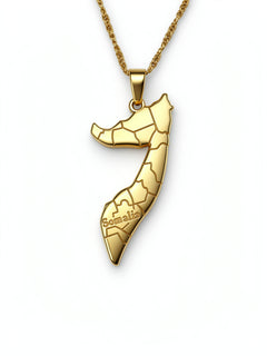 Gold plated Somalia map pendant necklace with regional outline details and Somalia engraved on the front on a linked chain from KIRO UK
