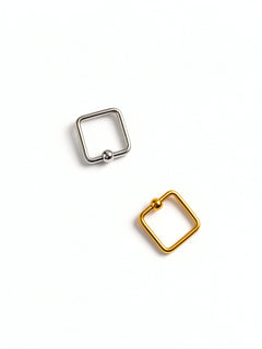 Gold and silver square septum rings set of two by KIRO UK with geometric edges and ball closures on a white background