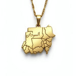 Gold plated Sudan map necklace with Arabic engraving on the pendant and a linked chain by KIRO UK on a white background